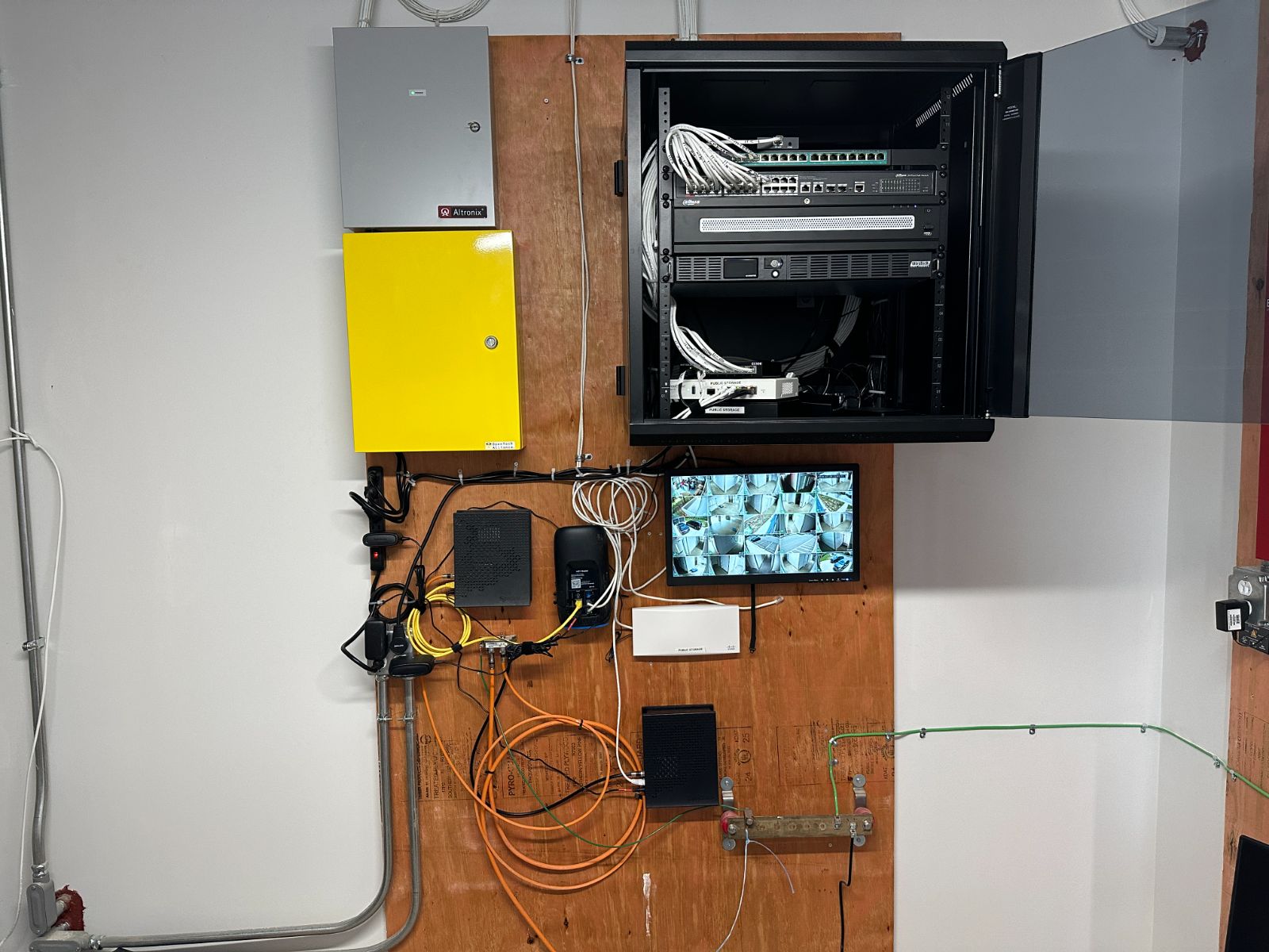 Security camera system install with network rack and live 16-camera monitor